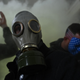 A supporter of President Donald Trump wears a gas mask as he protests after storming the Capitol on Jan. 6, 2021, in Washington, DC.